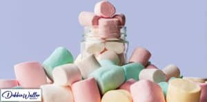 marshmallows in a glass jar to illustrate an article about willpower, and how to get more of it