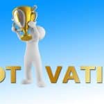figure holding up a trophy to illustrate an article on motivation