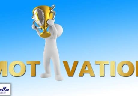 figure holding up a trophy to illustrate an article on motivation