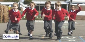 children running across a school playground to illustrate an article about a stress free start to the school year