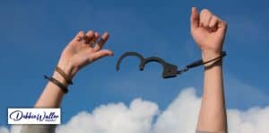 image of someone breaking free of handcuffs to illustrate an article on coping with the end of covid lockdown
