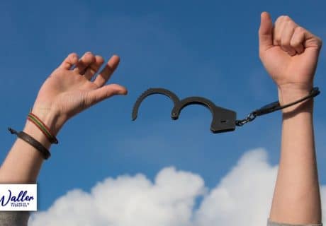 image of someone breaking free of handcuffs to illustrate an article on coping with the end of covid lockdown