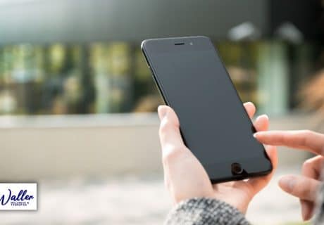 image of a woman using the phone to illustrate an article on why people don't get around to calling a therapist