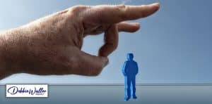 image of a hand flicking a critic away to illustrate an article on dealing better with criticism