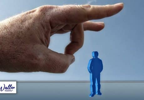 image of a hand flicking a critic away to illustrate an article on dealing better with criticism