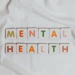 a tee shirt with the word mental health on the front to illustrate an article on mental health in lockdown