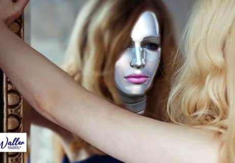 woman wearing a mask looking into a mirror to illustrate an article on imposter syndrome