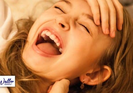 woman laughing to illustrate an article on the effect of laughter on mental health