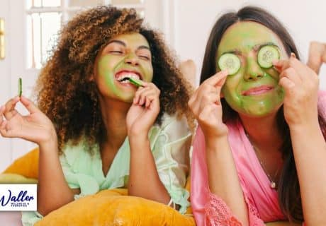 image of two friends laughing and wearing face masks to illustrate an article on self-care