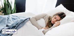 image of a woman asleep to illustrate an article on sleep and quitting smoking