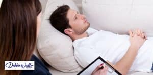 image of a man being hypnotised to illustrate an article about making the effects of hypnotherapy last