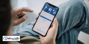 a man looking at social media on his phone to illustrate an article on social media and mental health