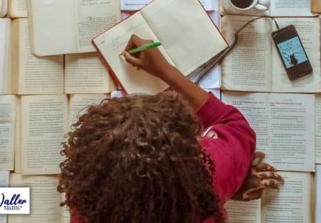 woman surrounded by paperwork to illustrate article on hypnotherapy research